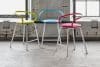 Kaloo bar stool by Karim Rashid for Materia — minimalist workplace seating with curved seat and straight steel frame