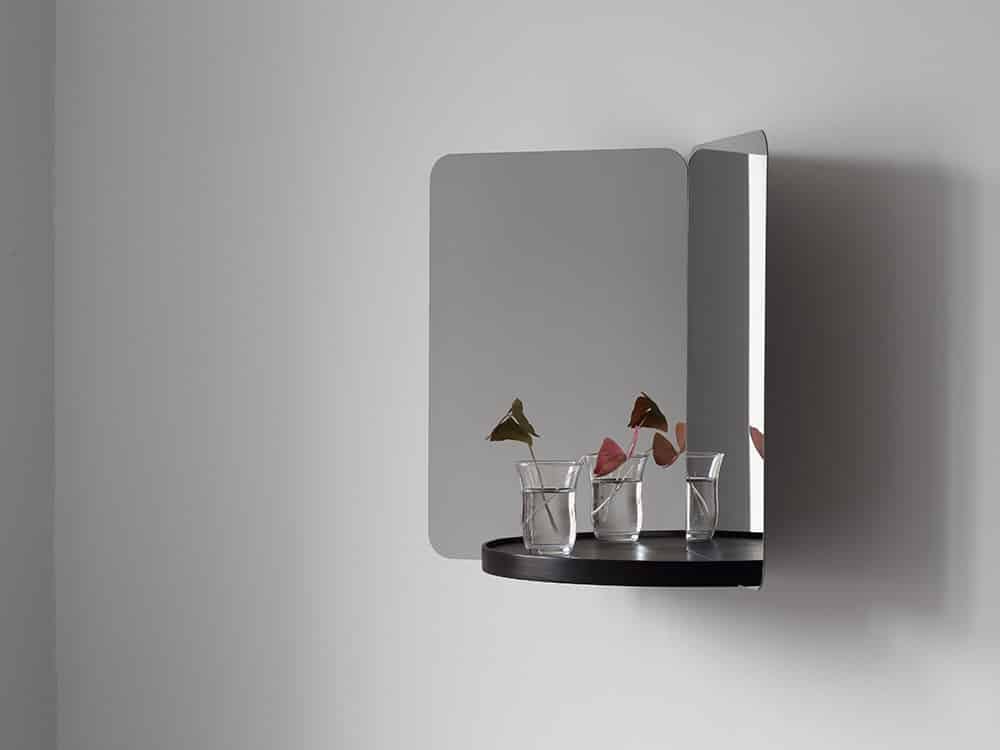 124° wall mirror by Daniel Rybakken for Artek featuring sculptural dual-aspect design in polished steel construction