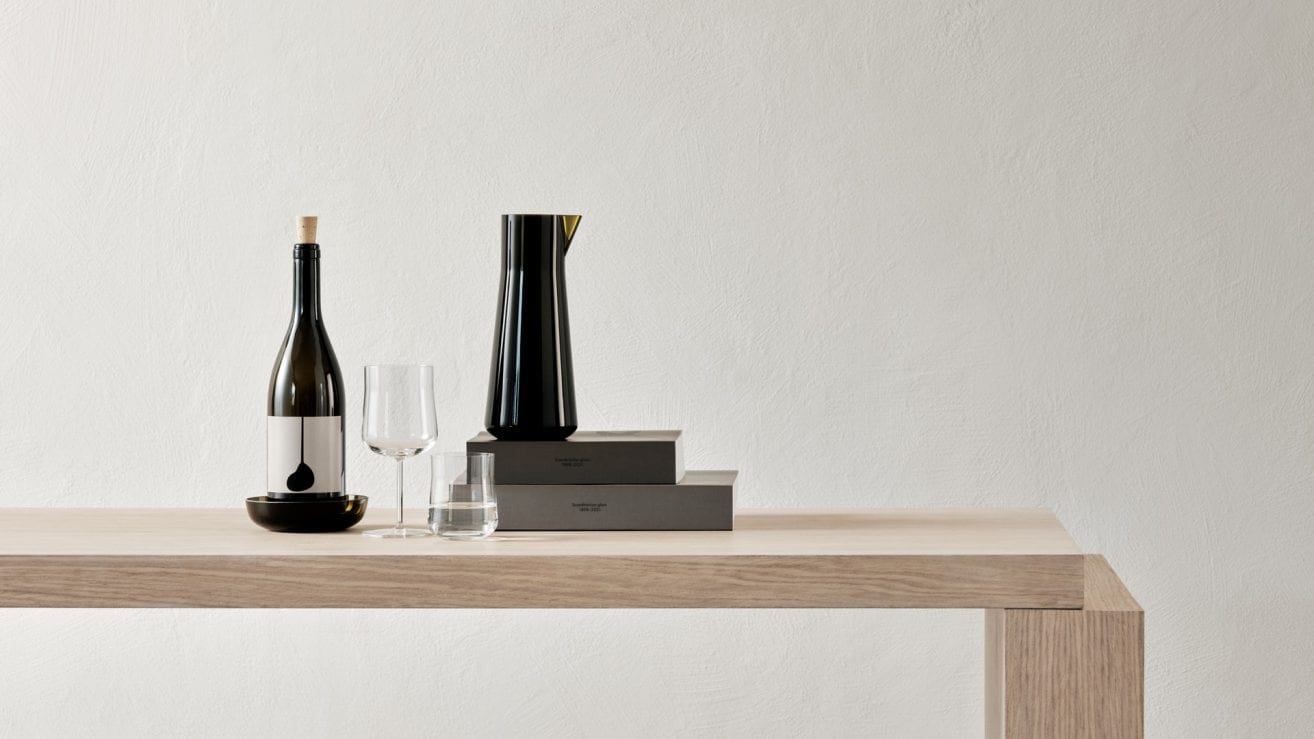 Informal glass collection by Björn Dahlström showing wine glasses and carafe for Orrefors Swedish design