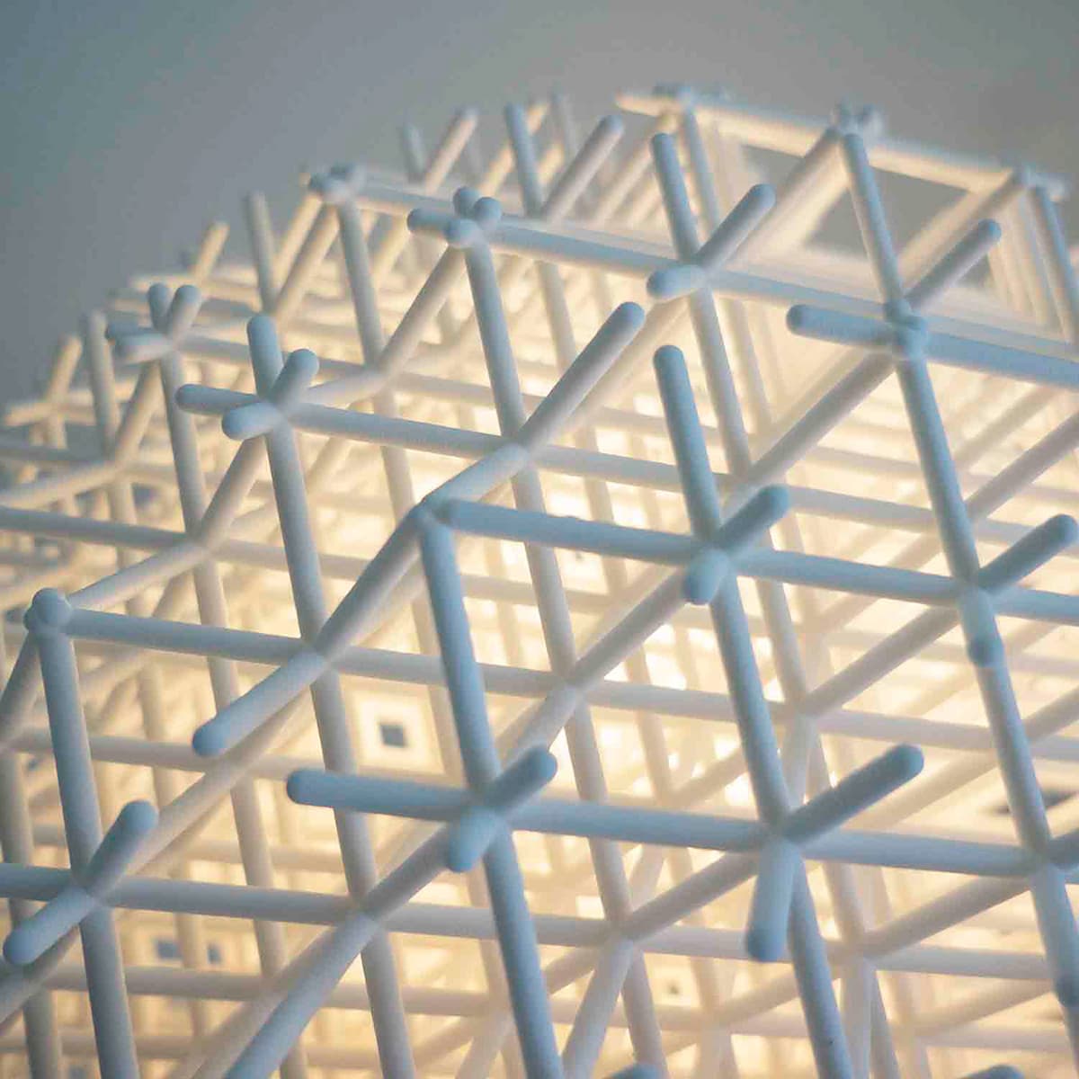 Lattice pendant by Charlotte von der Lancken, 3D-printed grid globe with moiré light effect