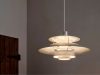 Louis Poulsen PH 5 Retake featuring stripped raw aluminum and steel shades with natural patina finish