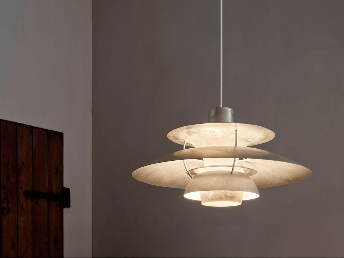Louis Poulsen PH 5 Retake featuring stripped raw aluminum and steel shades with natural patina finish