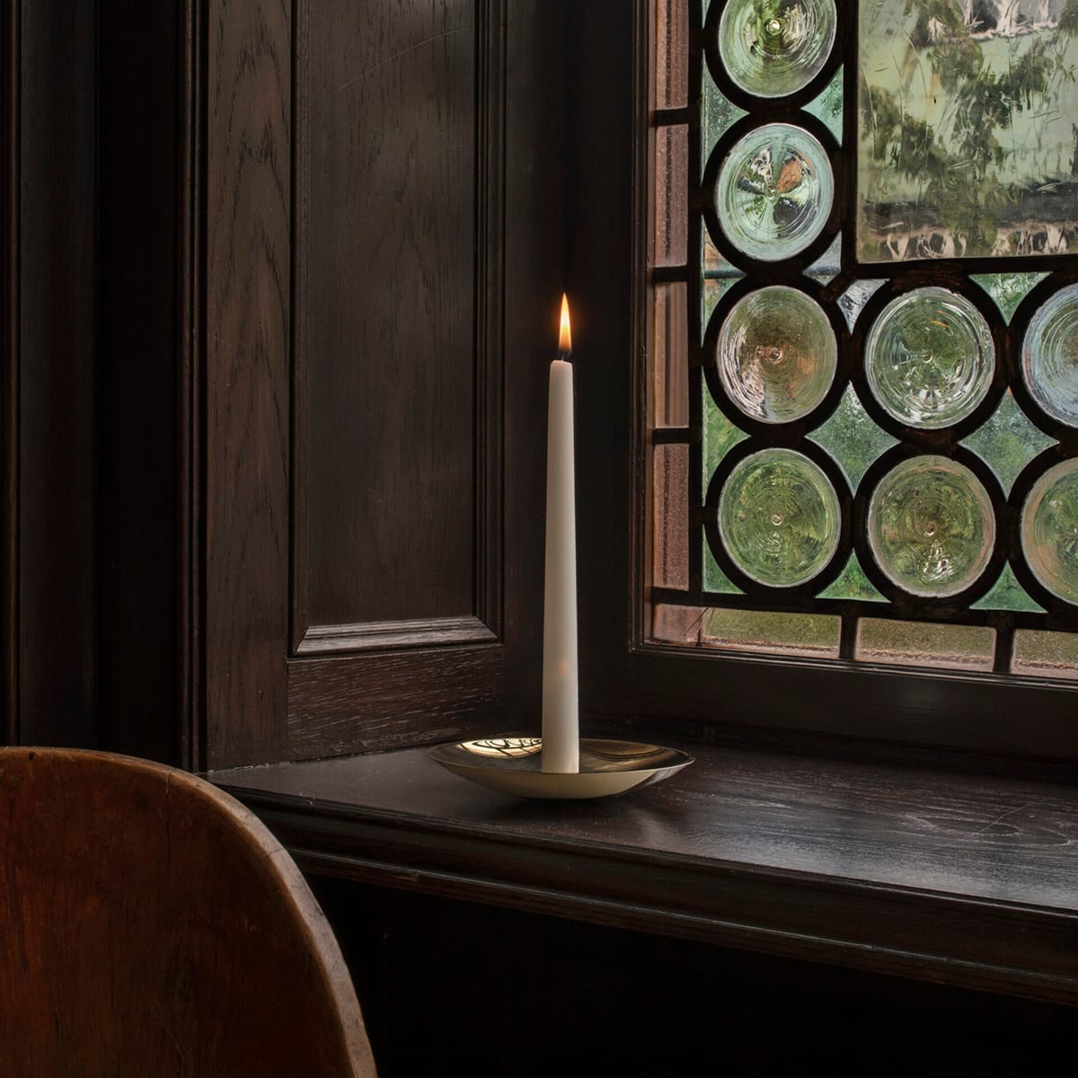 Holocene No. 6 brass candleholder by Ilse Crawford featuring concave disc design with central spike