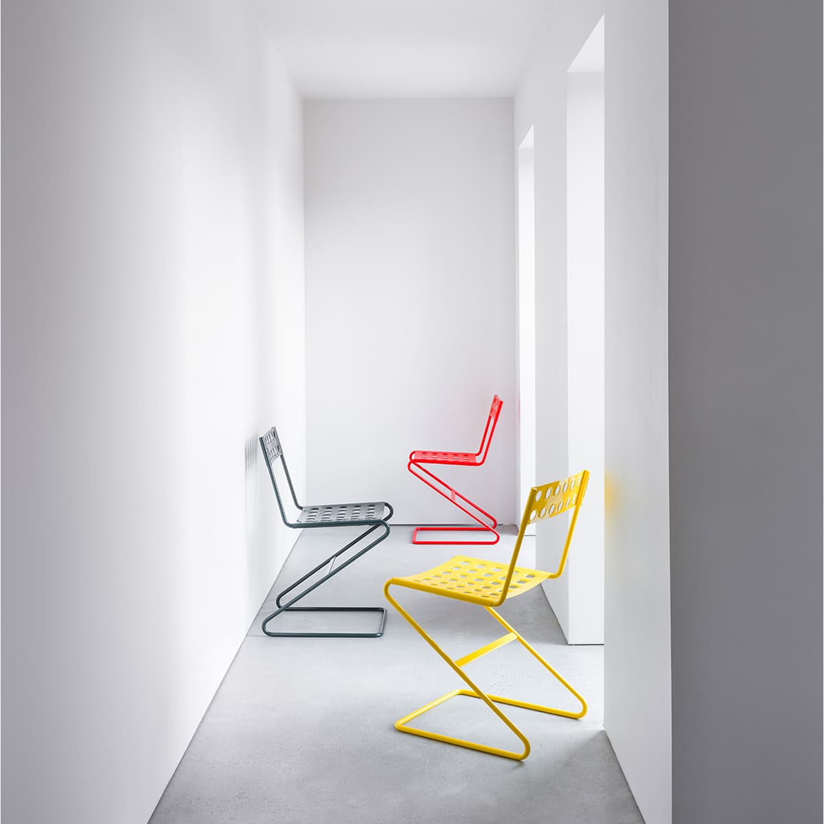 Zola chair by David Ericsson for Bebo Objects — spring steel frame and stamped sheet metal seat for indoor and outdoor use