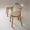 Storia collection including chair and stool variations, demonstrating Nikari's woodworking expertise