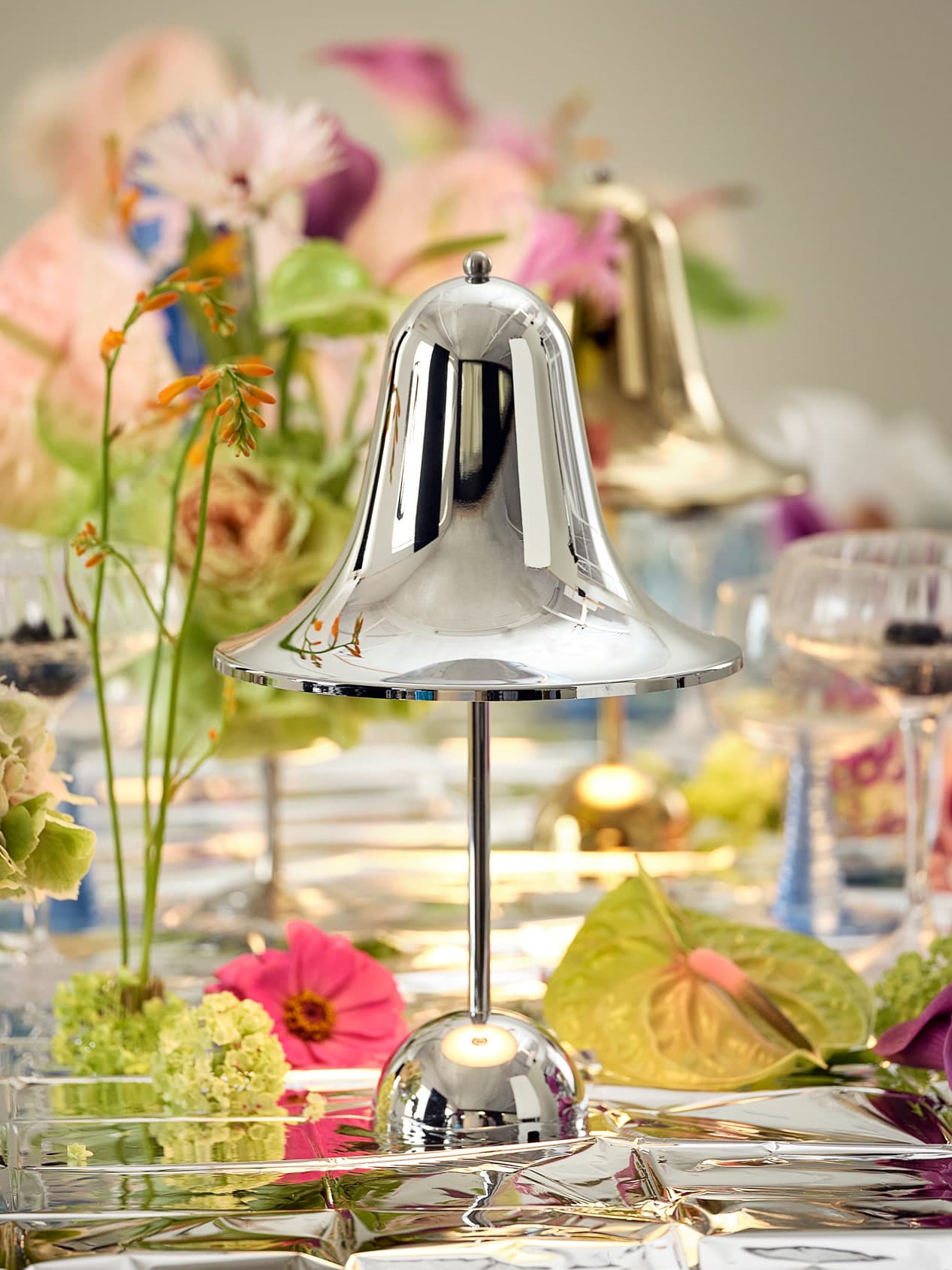 Pantop Portable chrome and brass table lamps by Verpan showing reflective metallic finishes and bell-shaped design