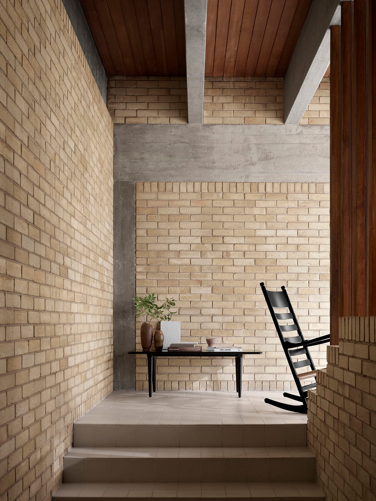 Hans J. Wegner rocking chair in black oak showcasing organic form and balanced proportions produced by Carl Hansen & Son