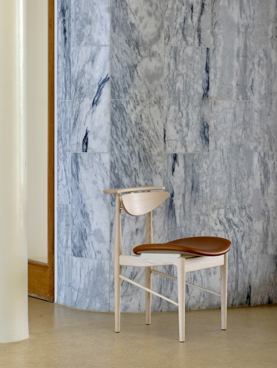 Finn Juhl's Reading Chair in ash wood by House of Finn Juhl featuring organic sculptural form