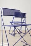 X-Line chair by Niels Jørgen Haugesen for Magnus Olesen featuring minimalist tubular steel construction