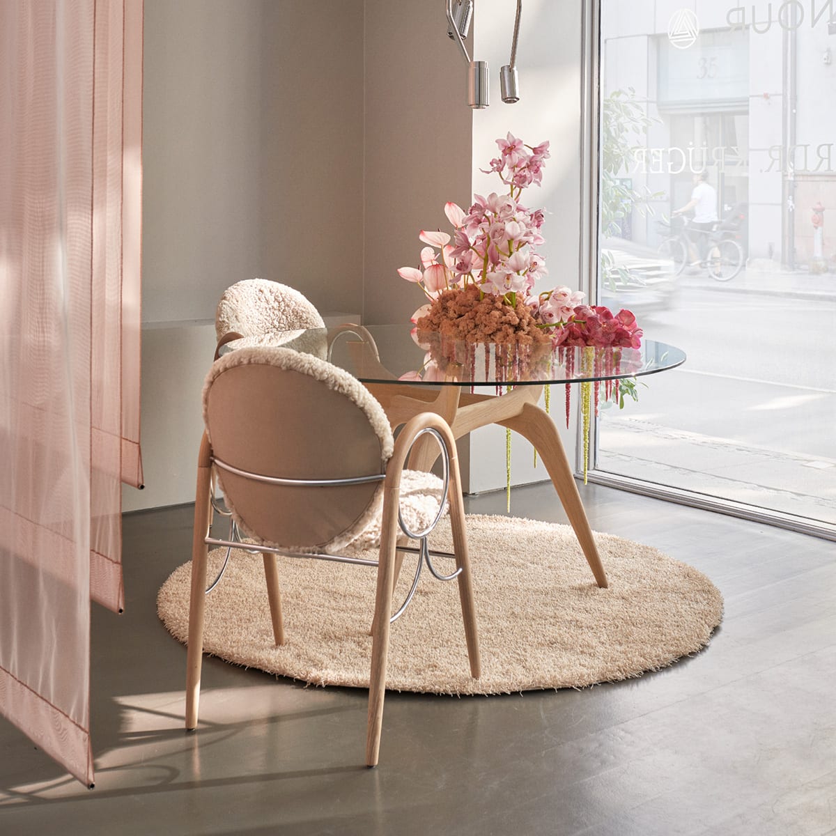 Anniversary edition of Nanna Ditzel's Arkade Chair by Brdr. Krüger featuring characteristic curved backrest
