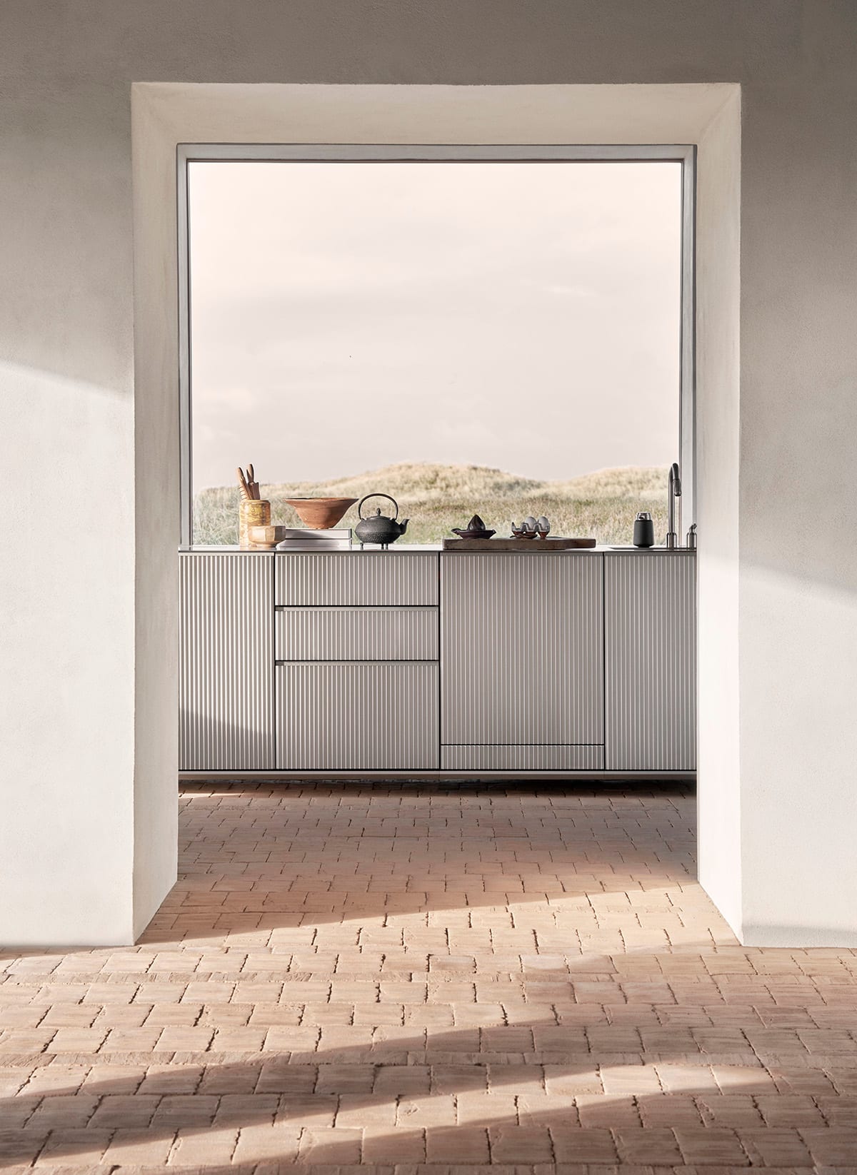 Vipp V3 Kitchen showcasing industrial-inspired design with powder-coated steel surfaces, integrated appliances and meticulous metalwork details.