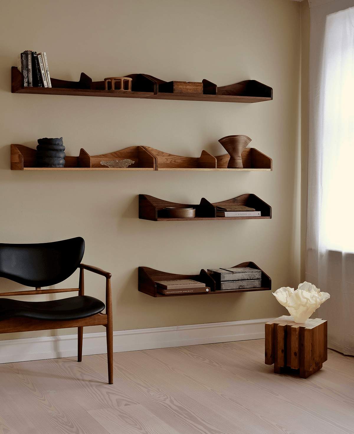 House of Finn Juhl's revived Hulso Shelf with characteristic organic shapes, floating design and functional storage compartments.