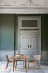 Morten Anker's Rib Outdoor Collection for Sibast Furniture featuring sleek wooden slats and contemporary Danish design for outdoor spaces.