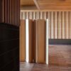 Separat space divider by Cecilie Manz now in two wood options, featuring minimalist vertical slats and clean lines.
