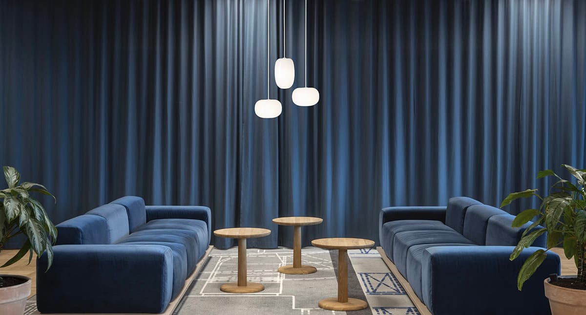 Pebble opal glass pendant lamp by Joel Karlsson for Örsjö with organic shape casting warm ambient light.