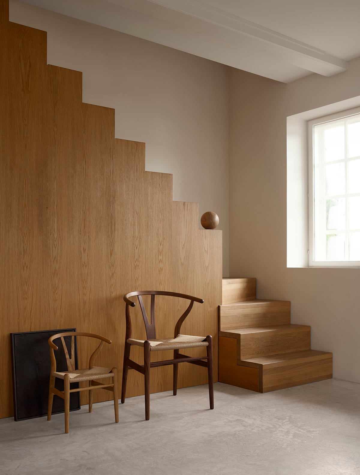 Carl Hansen & Søn introduces Hans J. Wegner's iconic Wishbone Chair in a perfectly scaled version for children, maintaining the original's distinctive design details and craftsmanship.