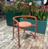 Cortado chair by Superlab for Nola featuring nimble design with low backrest and armrests in contemporary outdoor furniture