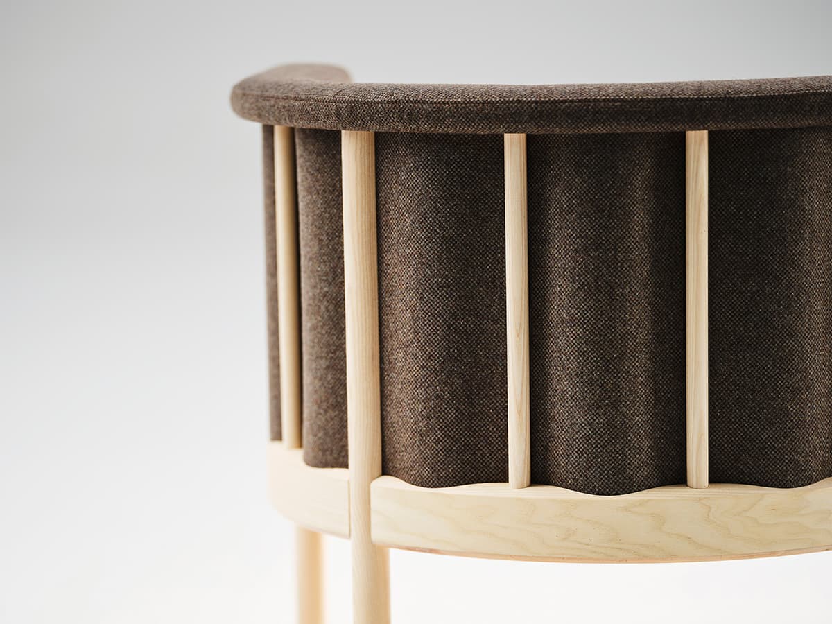 Round and comfortable Ondule Club chair by Anton Björsing designed for hospitality environments