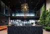 Multiple Terrace chandeliers installed in a commercial space demonstrating their sculptural quality and ambient lighting