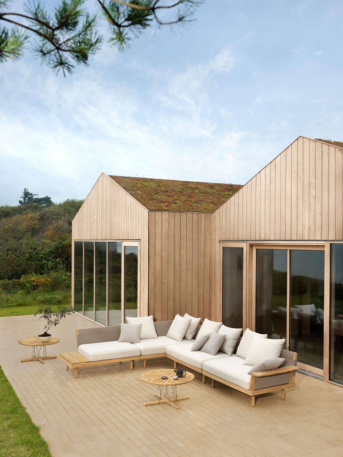 EMBRACE outdoor lounge series by EOOS for Carl Hansen & Søn featuring weather-resistant materials with distinctive woven details