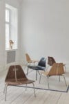 PK23 lounge chair by Poul Kjærholm for Fritz Hansen featuring sculptural form executed in molded plywood with minimal expression