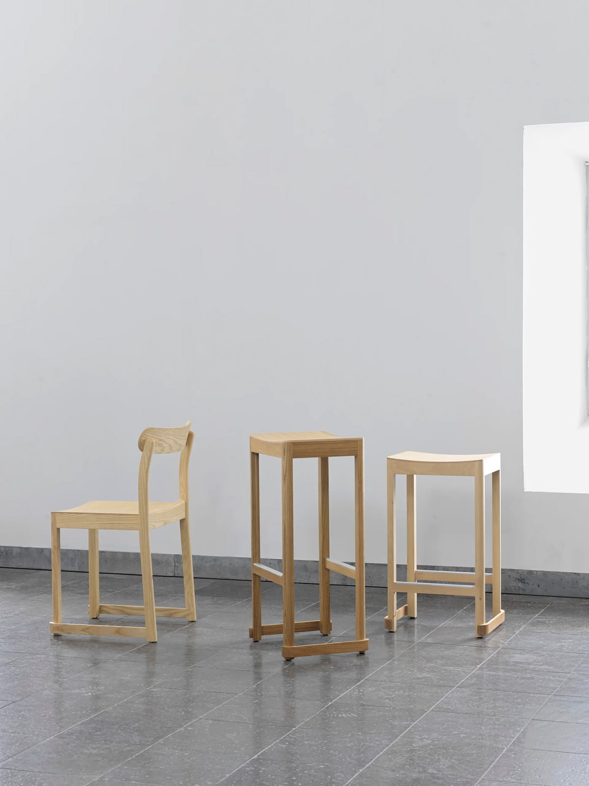 Atelier bar stool by TAF Studio for Artek featuring geometric lines and aluminum footrest reinforcement