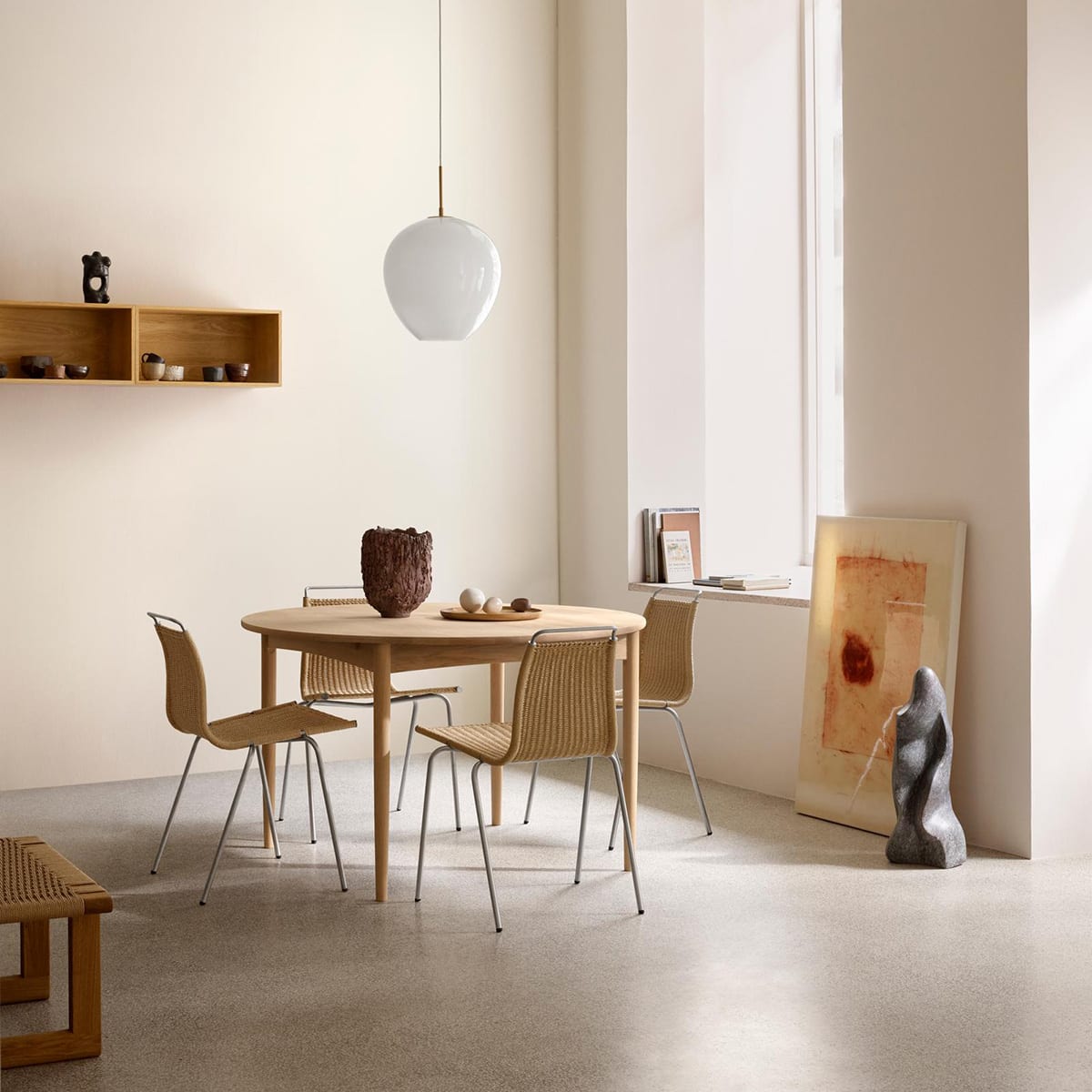 Børge Mogensen's BM0121 circular coffee table reissued by Carl Hansen & Søn featuring timeless Danish design and craftsmanship