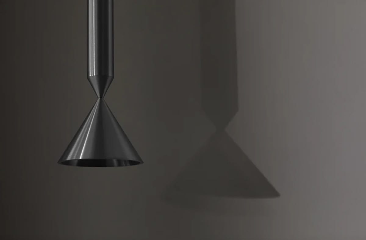 Apollo pendant lamp by PHOLC showing the distinctive end-on-end conical shapes in brushed aluminum finish.