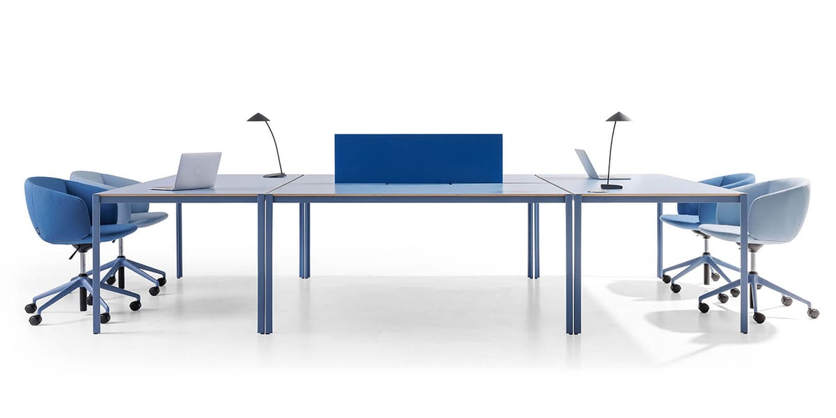 Multiple Sarek tables arranged in open office environment showing adaptability to various spatial needs