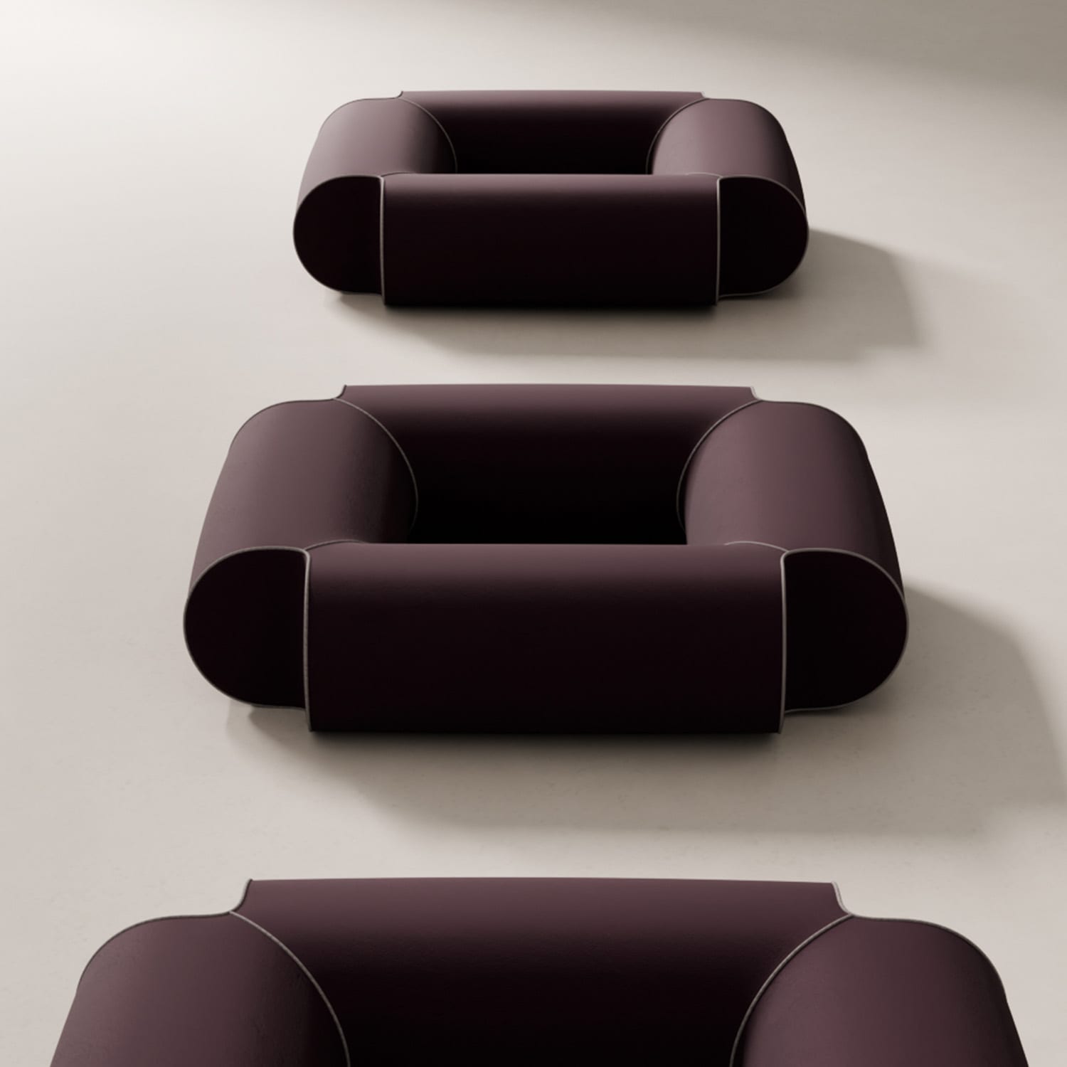 Geometric seating design cylindrical furniture forms minimalist aesthetic upholstered piping details floating base
