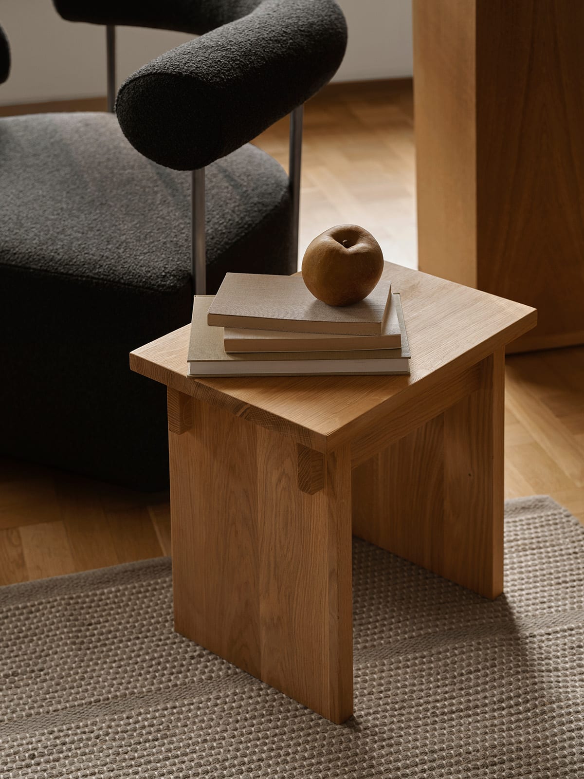 Kristinadamstudio-2025-artisan-stool-solitude-lounge-chair-left-oru-loom-rug | ScandinavianDesign.com