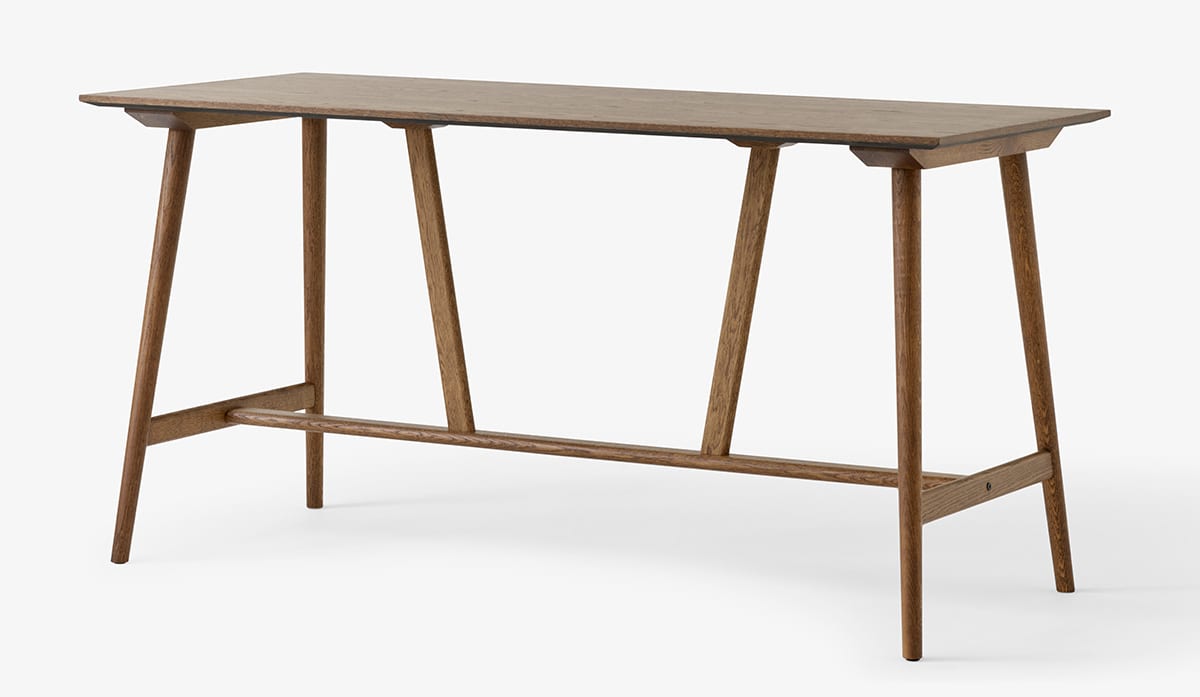 Side profile In Between counter table displaying minimalist elongated surface and architectural support system