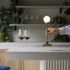 Snowball_portable_table_brass_on-bar_hand_northern_ph_sara-spilling | ScandinavianDesign.com
