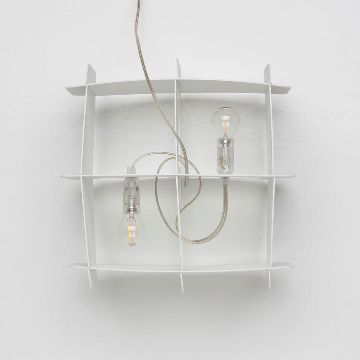 Ristikko pendant lamp isolated showing geometric birch plywood lattice design and warm lighting