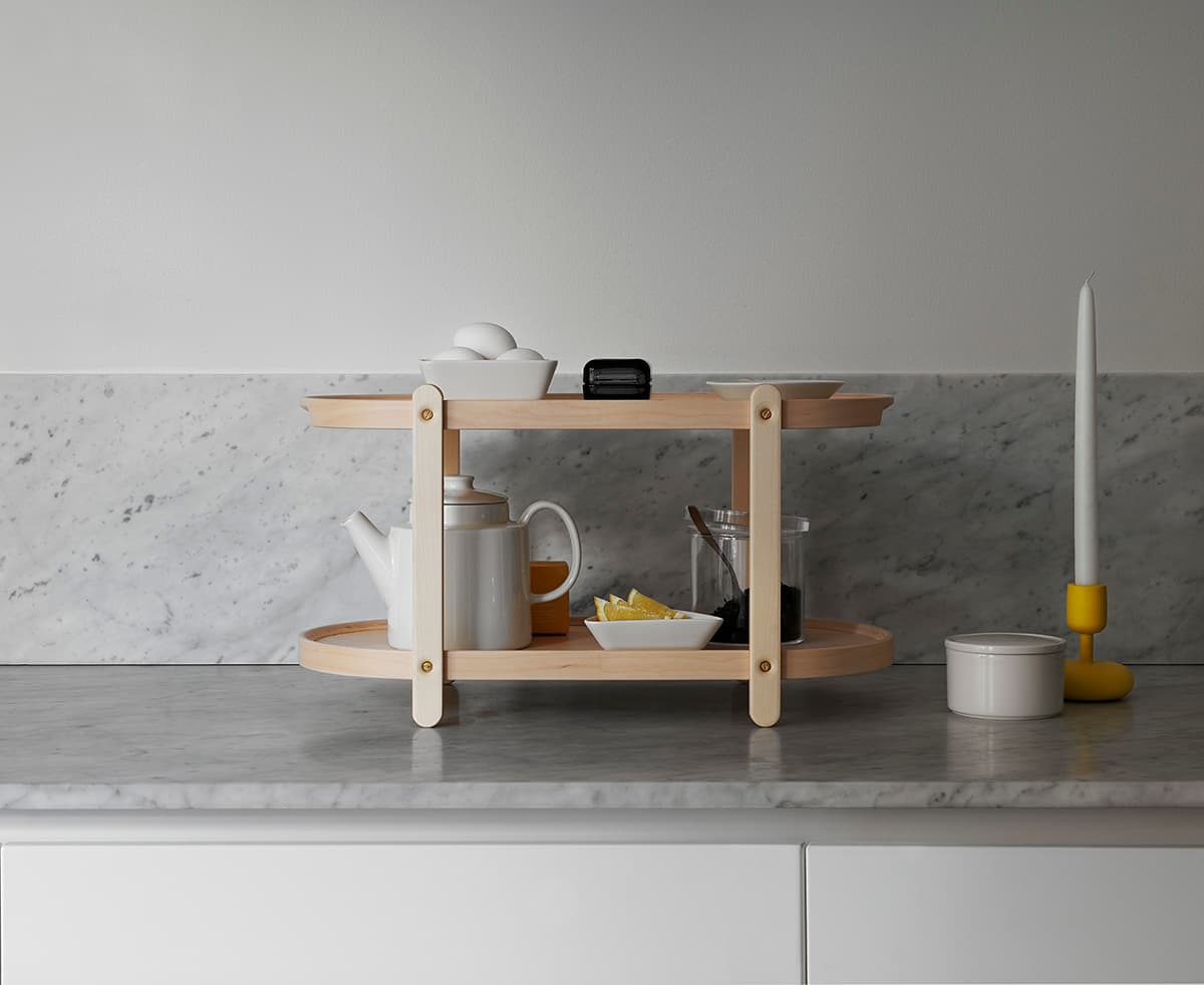 Kerros by Iittala used as serving tray and table for entertaining showing multi-purpose functionality
