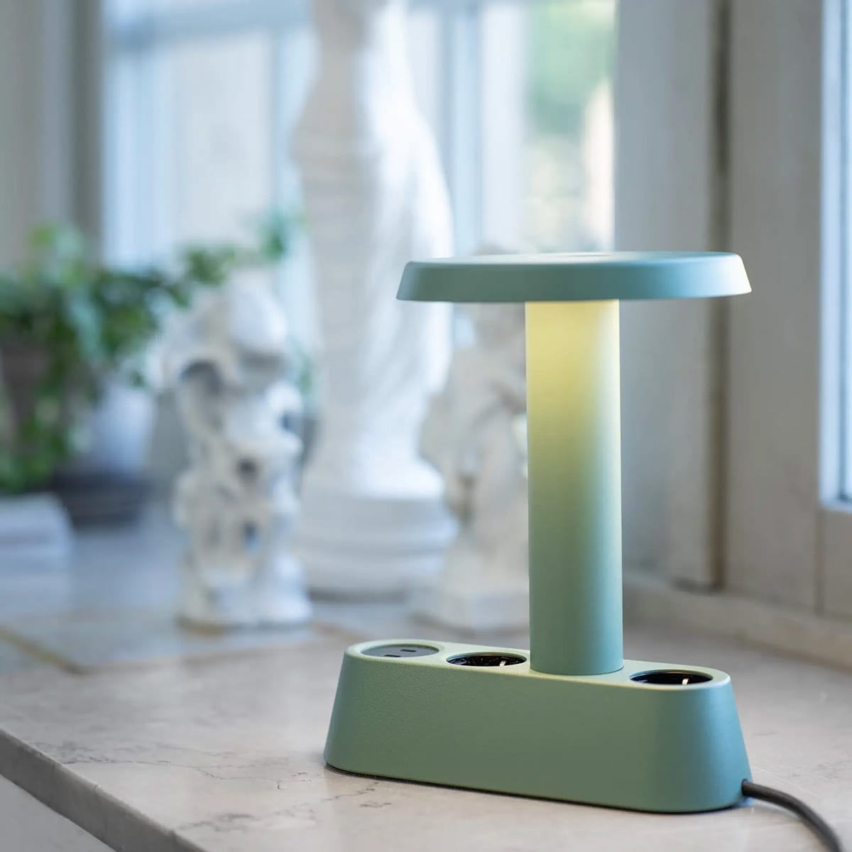 Modern charging solutions designed by Form Us With Love featuring colorful aluminum cases for office use