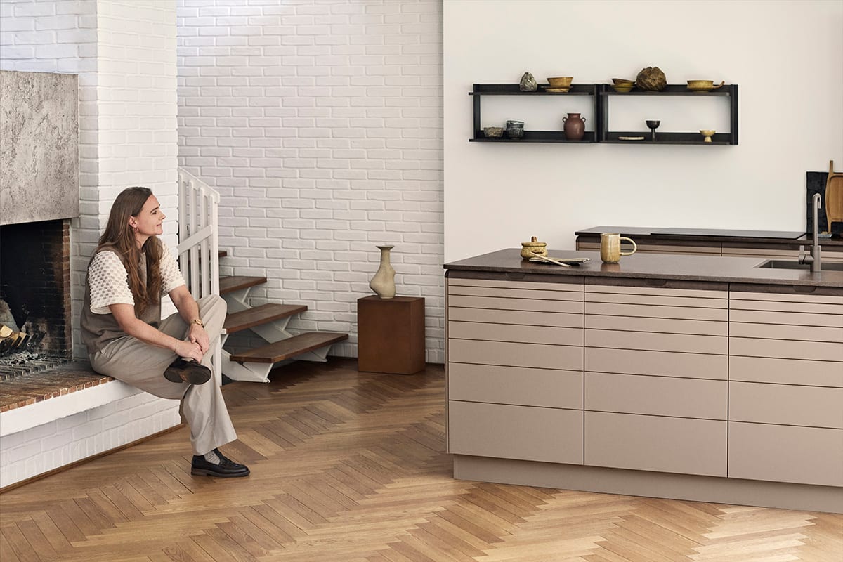 Align kitchen cabinetry with matte recycled PET surface and FSC certified oak handle integration