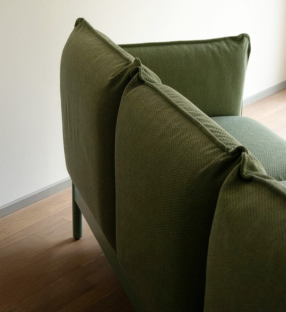 Close-up detail of Cirrus sofa removable upholstery showing gap between seat and backrest for optimal hygiene maintenance