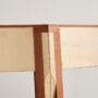 Close-up of The Børsen Chair showing maple and pear wood joint construction by Martin Kechayas