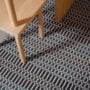 Each colour change in Ida’s pattern requires direct weaver attention — the result is a rich, tactile surface that rewards close inspection.