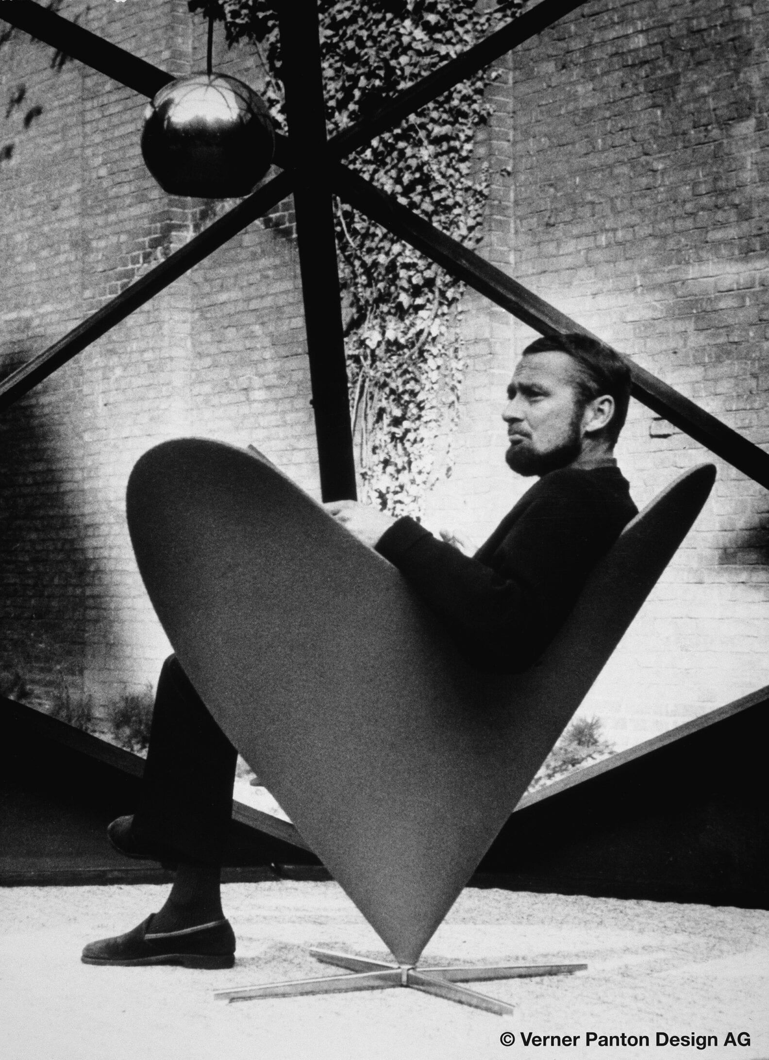 Verner Panton in his Heart Cone Chair designed in 1958 designed by Verner Panton VIP 211