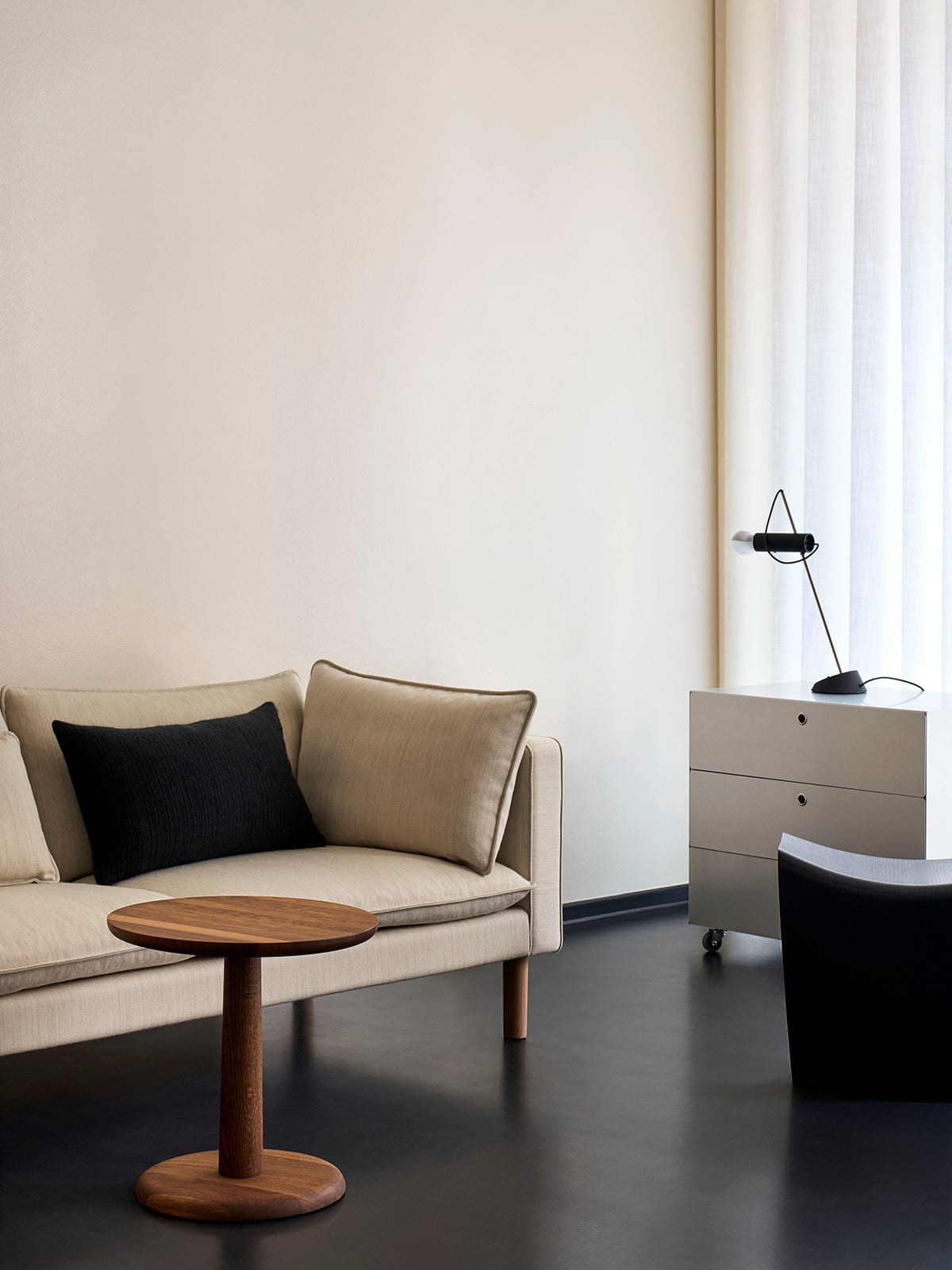 Refined upholstery detail of Jota Lounge sofa showing fabric weave, seating comfort proportions, and armrest form