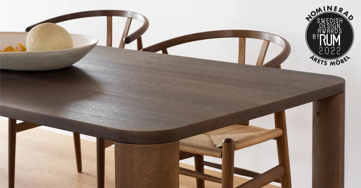 Moci dining table by Moa Sjöberg showing solid oak legs and elegant rounded edges for Asplund Sweden