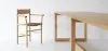 Akademia chair with armrests featuring curved seat and straight frame by Kaksikko for Nikari