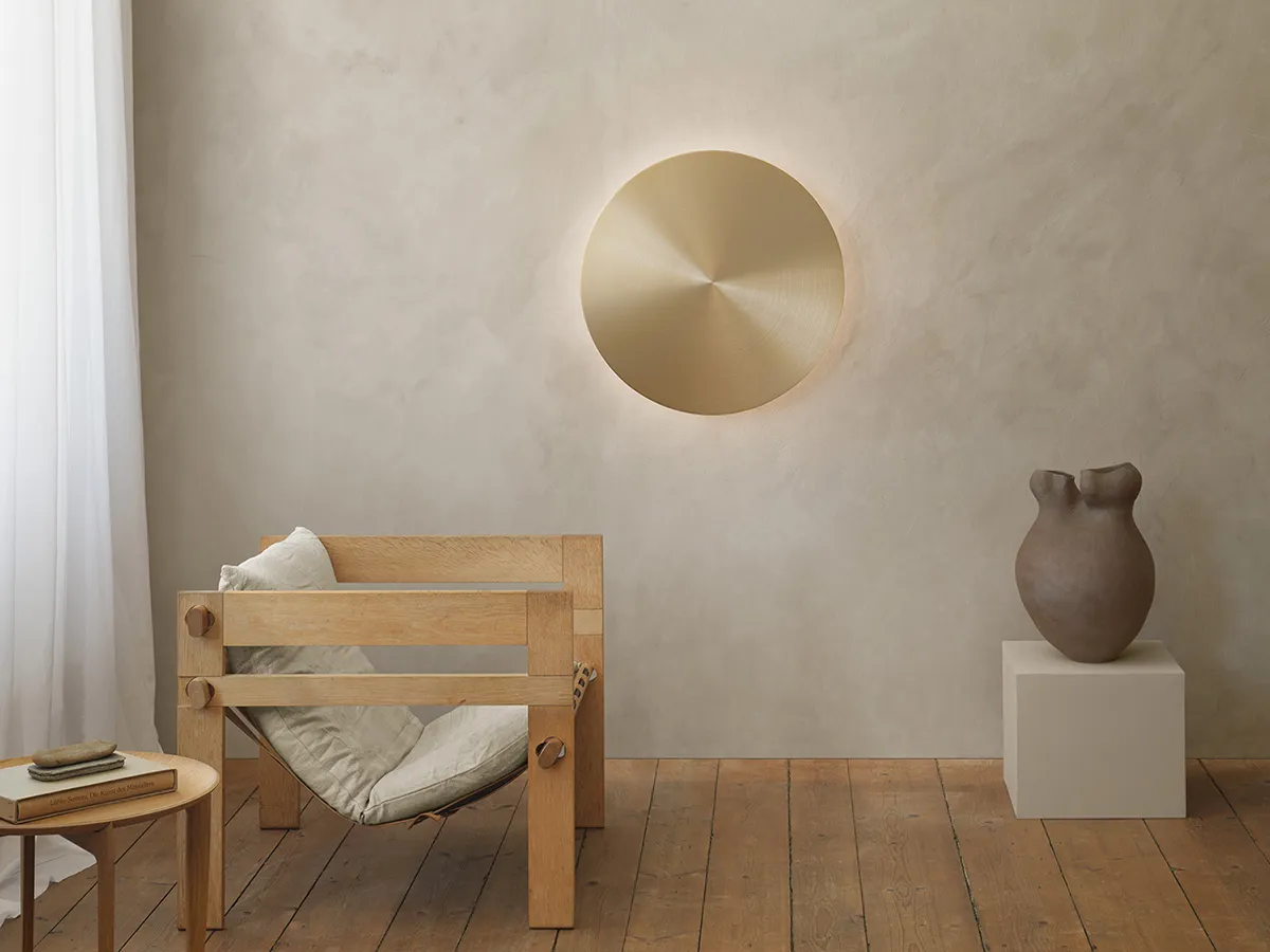 Alba wall light by Jordi Blasi for Atelje Lyktan featuring cymbal-inspired design and interactive control
