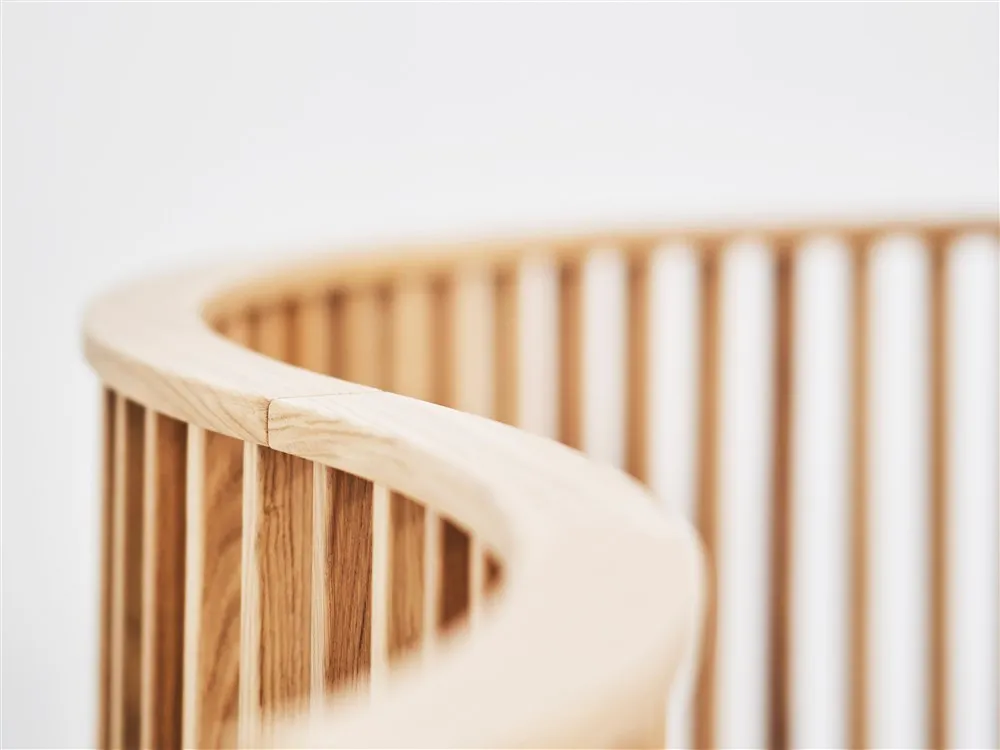 Detail Ray divider wooden slats create light patterns Indicum Inredningsarkitekter