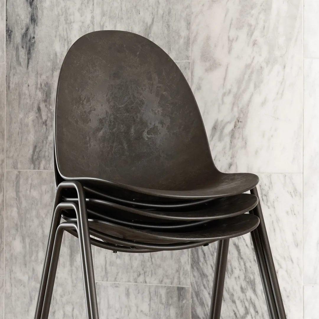 ETERNITY stackable chair by Space Copenhagen for Mater made from 70% plastic waste and 30% coffee shell waste