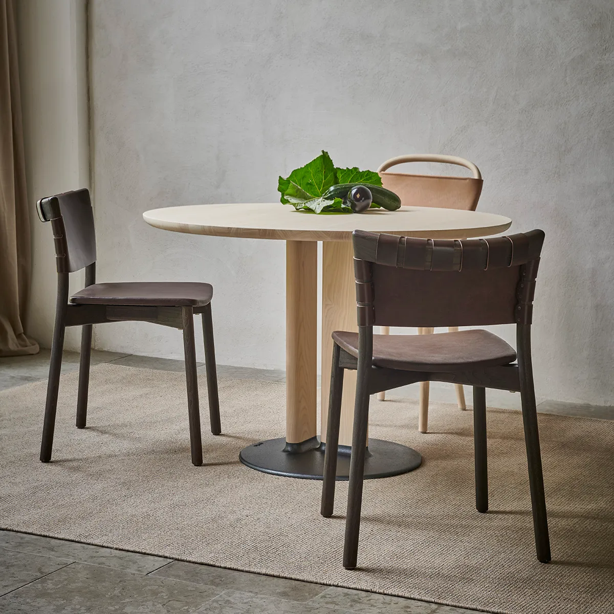 Sami Kallio Stam table family featuring sand cast iron base with solid ash top for Gemla furniture