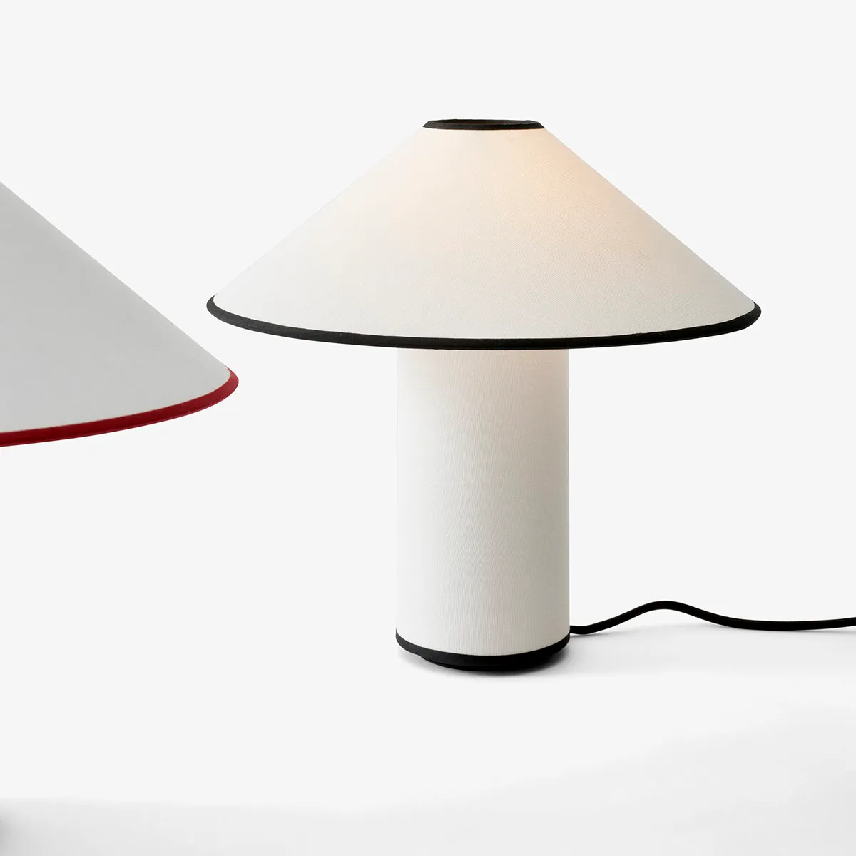 &tradition Colette table lamp featuring Art Deco inspired design with cotton-linen shade and brass details