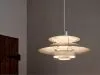 Louis Poulsen PH 5 Retake featuring stripped raw aluminum and steel shades with natural patina finish